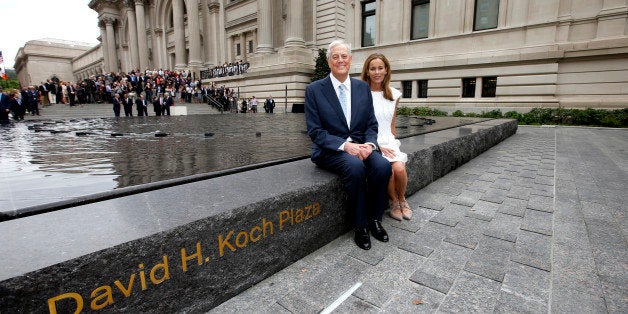 IMAGE DISTRIBUTED FOR DAVID H. KOCH FOUNDATION - David H. Koch, left, and Julia Koch as seen at the unveiling of the Metropolitan Museum of Art's new "David H. Koch Plaza," on Tues., Sept. 9, 2014 in New York. (Photo by Jason DeCrow/Invision for David H. Koch Foundation/AP Images)