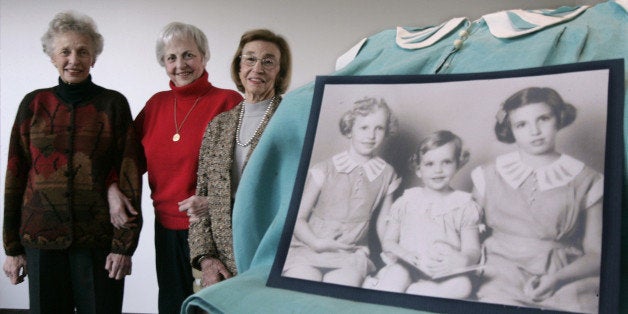 Three Sisters, from the left, Peggy Selonick, Susan Stern, and Jane Ellis, pose near a photo showing themselves in the same order as young girls, Friday, Feb. 4, 2005, at Hebrew Union College in Cincinnati. Their father, Morris Frieder, and his brothers operated a factory in the pre-World War II Philippines that helped rescue 1,200 Jewish refugees from Nazi Europe. A new permanent exhibit will be created at the Holocaust Center to honor their efforts. (AP Photo/Al Behrman)