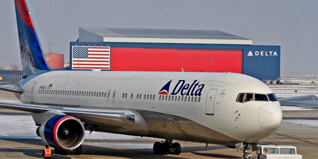 A Delta Air Lines Inc. Boeing 767-332 (N1402A) is pushed back from a gate at the Salt Lake City International Airport in Salt Lake City, Utah, U.S., on Monday, Dec. 28, 2009. Delta Air Lines Inc., American Airlines parent AMR Corp. and UAL Corp. fell in New York trading as a terrorism attempt on a Christmas Day flight to Detroit highlighted potential aviation risks. Photographer: George Frey/Bloomberg via Getty Images