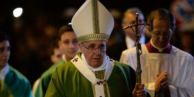 Pope Francis arrives to lead a mass during a pastoral visit at the parish of San Michele Arcangelo a Pietralata, on February 8, 2015 in Rome. AFP PHOTO / FILIPPO MONTEFORTE (Photo credit should read FILIPPO MONTEFORTE/AFP/Getty Images)