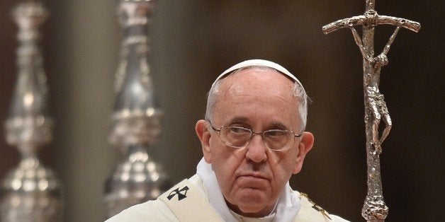 Pope Francis leads a mass at St Peter's basilica to celebrate the World Day for Consecrated Life on February 2, 2015 at the Vatican. AFP PHOTO / ALBERTO PIZZOLI (Photo credit should read ALBERTO PIZZOLI/AFP/Getty Images)