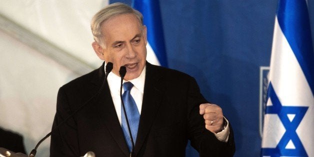 Israeli Prime Minister Benjamin Netanyahu delivers a speech during a swearing-in ceremony for Israel's new Chief of Staff Gadi Eisenkot at the Prime Minister's Jerusalem offices on February 16, 2015. AFP PHOTO / MENAHEM KAHANA (Photo credit should read MENAHEM KAHANA/AFP/Getty Images)