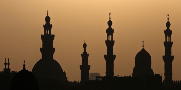 Birds fly over minaret's of mosques in Cairo on November 8, 2014. AFP PHOTO / MOHAMED EL-SHAHED (Photo credit should read MOHAMED EL-SHAHED/AFP/Getty Images)