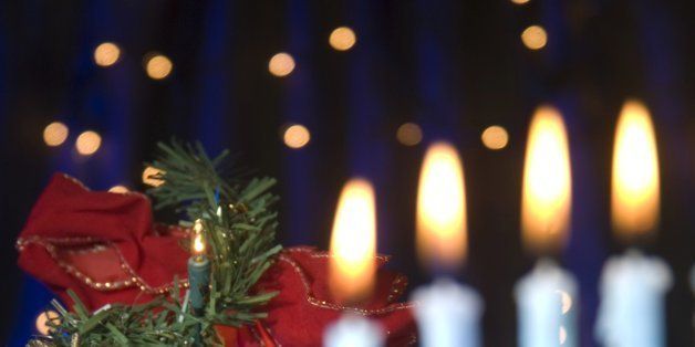 'A Hanukkah menorah and a Christmas tree together, symbolizing an interfaith holiday season. Focus is on the Christmas tree.'