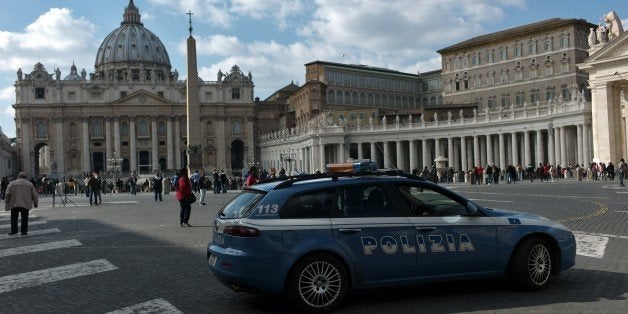 Policemen patrol at St Peter's square on February 19, 2015 at the Vatican. Security at the Vatican and across Italy has been stepped up because of a perceived heightened risk of attacks by Islamist militants, officials said on February 18, 2015. A day after the Italian cabinet approved new security measures because of fears of a terrorist spillover from the chaos engulfing Libya, the head of the Vatican's Swiss Guard confirmed additional precautions had been taken to ensure the safety of Pope Francis. AFP PHOTO / FILIPPO MONTEFORTE (Photo credit should read FILIPPO MONTEFORTE/AFP/Getty Images)