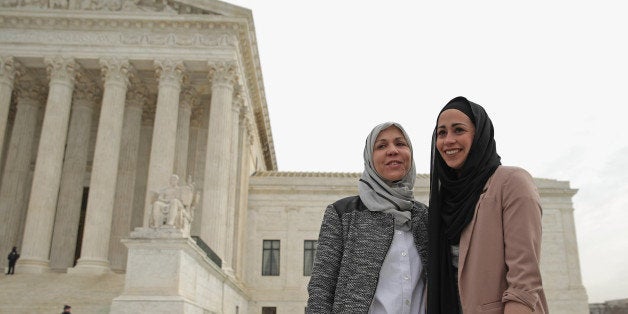 WASHINGTON, DC - FEBRUARY 25: Samantha Elauf (R) and her mother Majda Elauf of Tulsa, Oklahoma, pose for photographers outside the U.S. Supreme Court after the court heard oral arguments in EEOC v. Abercrombie & Fitch February 25, 2015 in Washington, DC. Elauf filed a charge of religious discrimination with the Equal Employment Opportunity Commission saying Abercrombie & Fitch violated discrimination laws in 2008 by declining to hire her because she wore a head scarf, a symbol of her Muslim faith. (Photo by Chip Somodevilla/Getty Images)