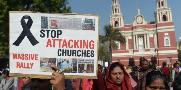 Minority Indian Christians demonstrate outside the Sacred Heart Cathedral following recent attacks on churches in New Delhi on February 5, 2015. Hundreds of minority Christians protested outside a church in the Indian capital February 5 as priests and demonstrators said they feel insecure under Prime Minister Narendra Modi's government after a series of unsolved attacks on churches in the city. AFP PHOTO / SAJJAD HUSSAIN (Photo credit should read SAJJAD HUSSAIN/AFP/Getty Images)