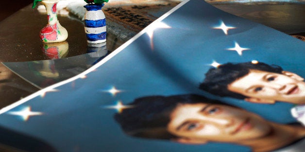 FILE -In this Dec. 10, 2014 file photo, Prison artwork created by Adnan Syed sits near family photos in the home of his moth