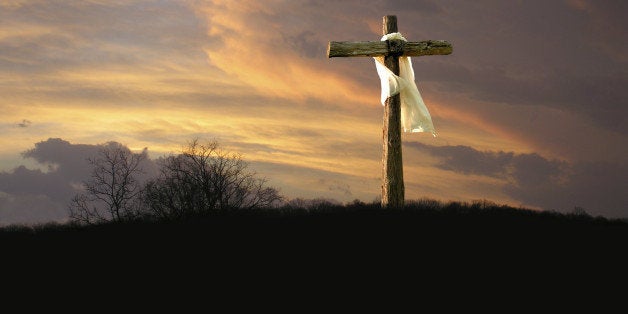 The cross of Jesus Christ from the Bible. The garment is blowing in the wind, left to right, suggesting that the brighter skies on the left are coming soon.