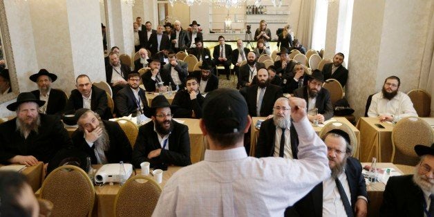 Rabbis take part in a first aid training during the Conference of European Rabbis in Prague, Czech Republic, Tuesday, Feb. 24, 2015. Due to the recent attacks on Jewish communities in Europe, part of the conference was a self defense and first aid training. (AP Photo/Petr David Josek)