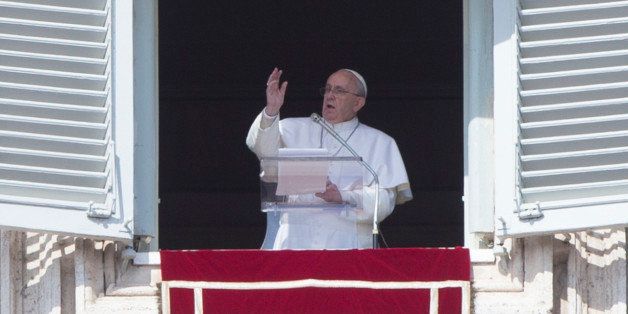 Pope Francis delivers his blessing during the Angelus noon prayer from the window of his studio overlooking St. Peter's Square, at the Vatican, Sunday, March 1, 2015. (AP Photo/Riccardo De Luca)