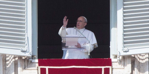 Pope Francis delivers his blessing during the Angelus noon prayer from the window of his studio overlooking St. Peter's Square, at the Vatican, Sunday, March 1, 2015. (AP Photo/Riccardo De Luca)