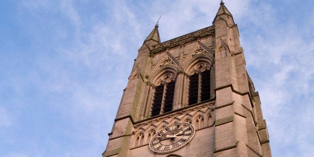 'The church tower and clock at Bolton parish church, Lancashire.'