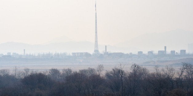 North Korea's propaganda village of Gijungdong is seen from a South Korean military check point of the truce village of Panmunjom in the Demilitarized Zone dividing the two Koreas on February 4, 2015. North Korea appeared to rule out any resumption of dialogue with the United States, threatening to react to any US 'war of aggression' with nuclear strikes and cyber warfare. AFP PHOTO / JUNG YEON-JE (Photo credit should read JUNG YEON-JE/AFP/Getty Images)