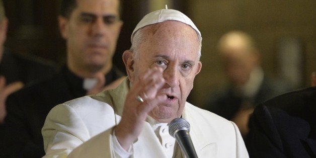 Pope Francis makes the sign of the cross at the end of a pastoral visit to the Roman Parish of 'Santa Maria Madre del Redentore a Tor Bella Monaca' on March 8, 2015 in Rome. AFP PHOTO / ANDREAS SOLARO (Photo credit should read ANDREAS SOLARO/AFP/Getty Images)