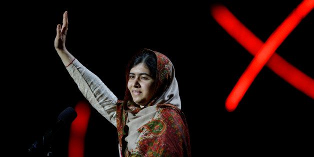 Joint-Nobel Peace Prize winner Malala Yousafzai from Pakistan waves as she arrives to speak on stage during the Nobel Peace Prize Concert in Oslo, Norway, Thursday, Dec. 11, 2014. Malala Yousafzai from Pakistan and Kailash Satyarthi of India received the Nobel Peace Prize on Wednesday for risking their lives to help protect children from slavery, extremism and forced labor at great risk to their own lives. (AP Photo/Matt Dunham)