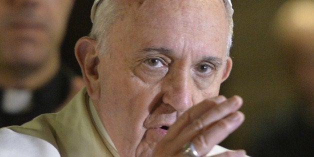 Pope Francis makes the sign of the cross at the end of a pastoral visit to the Roman Parish of 'Santa Maria Madre del Redentore a Tor Bella Monaca' on March 8, 2015 in Rome. AFP PHOTO / ANDREAS SOLARO (Photo credit should read ANDREAS SOLARO/AFP/Getty Images)