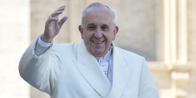 Pope Francis waves to the crowd as he arrives in St Peter's square for the 60th anniversary of the Comunione e Liberazione (Communion and Liberation) catholic mouvement on March 7, 2015 at the Vatican. AFP PHOTO / ANDREAS SOLARO (Photo credit should read ANDREAS SOLARO/AFP/Getty Images)