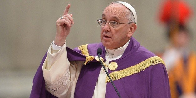 Pope Francis speaks during a penitential ceremony on March 13, 2015 at St Peter's basilica in Vatican. Pope Francis declared an extraordinary jubilee year to celebrate the 50th anniversary of a landmark Vatican council and said the Church was bound to continue its reforming work. The year will be dedicated to the theme of mercy and begin on December 8th, the date the Vatican II council closed in 1965, Francis said in St Peter's cathedral on the second anniversary of his election as pope. AFP PHOTO / ALBERTO PIZZOLI (Photo credit should read ALBERTO PIZZOLI/AFP/Getty Images)