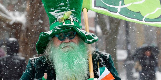 Dick Shea, dressed as a leprechaun, gives a thumbs up while marching in the all-inclusive St. Pat's For All parade in the Sunnyside, Queens neighborhood of New York, Sunday, March 1, 2015. The parade, which embraces diversity and inclusion, is considered an alternative to New York City's official St. Patrick's Day parade, held March 17.(AP Photo/Kathy Willens)