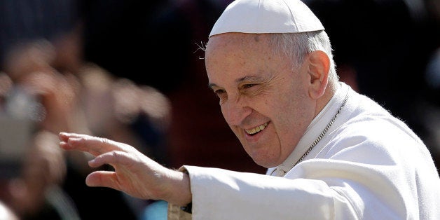 Pope Francis waves to faithful as he arrives for his weekly general audience in St. Peter's Square, at the Vatican, Wednesday, March 18, 2015. (AP Photo/Gregorio Borgia)