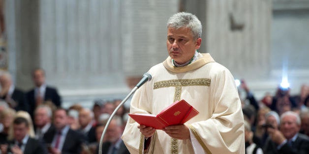 In this photo taken on Sept.19, 2013 provided by the Vatican newspaper L'Osservatore Romano, Vatican Almoner, Archbishop Konrad Krajewski attends the ceremony for his episcopal ordination, in St. Peter's Basilica, at the Vatican. The existence of the Vatican Almoner dates back centuries: It is mentioned in a papal bull from the 13th-century Pope Innocent III, and Pope Gregory X, who ruled from 1271-1276, organized it into an official Holy See office for papal charity. Up until Krajewski came along, the almoner was typically an aging Vatican diplomat who was serving his final years before being allowed to retire at age 75. Francis changed all that, tapping the 50-year-old Pole to be a more vigorous, hands-on extension of himself. The almoner's duties are two-fold: carrying out acts of charity, and raising the money to fund them. (AP Photo/L'Osservatore Romano, ho)