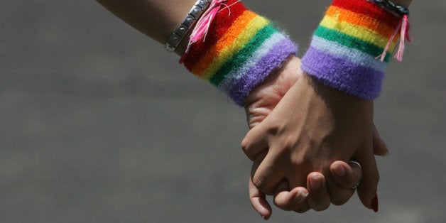 TEL AVIV, ISRAEL - JUNE 8: A lesbian couple hold hands during the annual Gay Pride rally, on June 8, 2007 Tel Aviv, Israel's