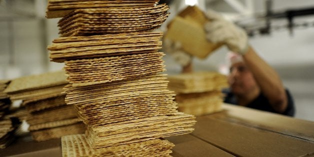 A worker at Streitâs Matzo factory on the lower east side of New York stacks matzo wafers on May 9, 2012. Aron Streit, Inc.