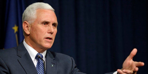 Indiana Gov. Mike Pence holds a news conference at the Statehouse in Indianapolis, Thursday, March 26, 2015. Pence has declared a public health emergency in response to the HIV epidemic in Scott County. Seventy two cases of HIV have been confirmed in the southern Indiana county. (AP Photo/Michael Conroy)