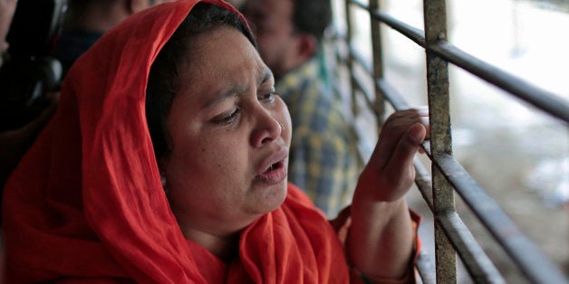 Shilpi, a cousin of late Bangladeshi blogger Washiqur Rahman Babu, wails outside a morgue at the Dhaka Medical College in Dha