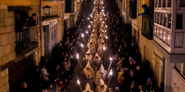 Penitents from 'Cristo de la Buena Muerte' or 'Good Dead Christ' brotherhood take part in a procession in Zamora, Spain, early Tuesday, March 31, 2015. Hundreds of processions take place throughout Spain during the Easter Holy Week. (AP Photo/Andres Kudacki)