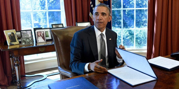 President Barack Obama speaks in the Oval Office of the White House in Washington, Tuesday, March 31, 2015, after signing a M