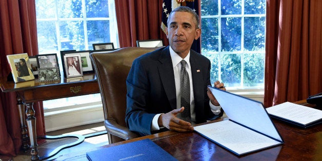 President Barack Obama speaks in the Oval Office of the White House in Washington, Tuesday, March 31, 2015, after signing a Memorandum of Disapproval Regarding S.J. Res. 8, a Joint Resolution providing for congressional disapproval of the rule submitted by the National Labor Relations Board relating to representation case procedures. (AP Photo/Susan Walsh)