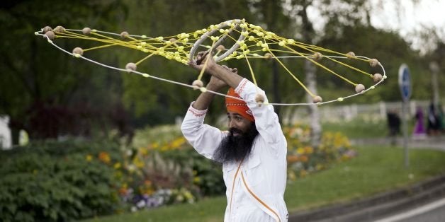 Indian Sikh pilgrims parade on April 13, 2014 in Bobigny, near Paris, during celebrations for Vaisakhi, the Sikh New Year Fes