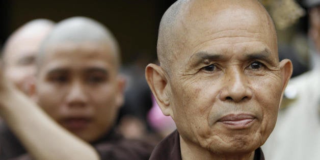 Ho Chi Minh City, VIET NAM: CORRECTION Zen Buddhist leader Thich Nhat Hanh (R) walks during a procession at the opening of a three-day requiem for those killed on both sides of the Vietnam War, 16 March 2007 at a pagoda in Ho Chi Minh City. The monk, who is on his second return visit in the country and opposed the war and was barred from his homeland by both the former US-backed South Vietnamese and the post-1975 communist governments, said he hoped to aid national reconciliation. AFP PHOTO (Photo credit should read STR/AFP/Getty Images)