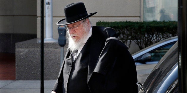 Rabbi Mendel Epstein, 69, arrives at federal court as the jury deliberations continue into the third day in his case Tuesday, April 21, 2015, in Trenton, N.J. The Orthodox rabbi is accused of using brutal tactics to force unwilling Jewish men to divorce their wives. Rabbi Epstein faces charges of conspiracy to commit kidnapping and attempted kidnapping with his son and two other Orthodox rabbis. Prosecutors say the rabbi's team used brutal methods and tools, including handcuffs and electric cattle prods, to torture the men into granting divorces. (AP Photo/Mel Evans)