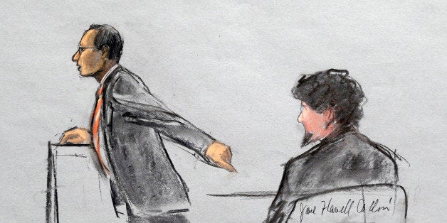 In this courtroom sketch, Assistant U.S. Attorney Aloke Chakravarty is depicted pointing to defendant Dzhokhar Tsarnaev, right, during closing arguments in Tsarnaev's federal death penalty trial Monday, April 6, 2015, in Boston. Tsarnaev is charged with conspiring with his brother to place two bombs near the Boston Marathon finish line in April 2013, killing three and injuring 260 people. (AP Photo/Jane Flavell Collins)