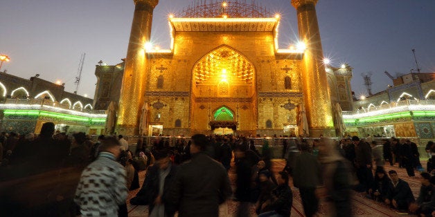 In this Thursday, Jan. 8, 2015 photo, Shiite faithful pilgrims pray at the holy shrine of Imam Ali in the Shiite holy city of