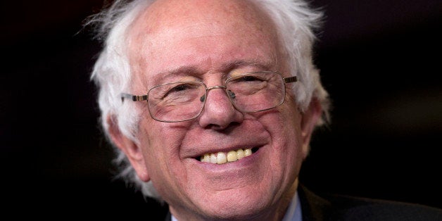 Sen. Bernie Sanders, I-Vt., smiles as he is asked about running for president during a news conference on Capitol Hill in Washington, Wednesday, April 29, 2015. Sanders will announce his plans to seek the Democratic nomination for president on Thursday, presenting a liberal challenge to Hillary Rodham Clinton. Sanders, an independent who describes himself as a "democratic socialist," will follow a statement with a major campaign kickoff in his home state in several weeks. Two people familiar with his announcement spoke to The Associated Press under condition of anonymity to describe internal planning. (AP Photo/Carolyn Kaster)