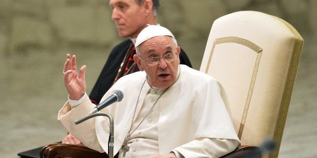 Pope Francis gestures during an audience with the Vita Cristiana community in the Paul VI hall at the Vatican on April 30, 2015. AFP PHOTO / TIZIANA FABI (Photo credit should read TIZIANA FABI/AFP/Getty Images)