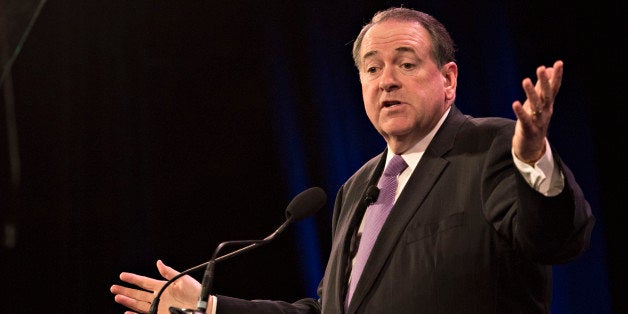 Mike Huckabee, former governor of Arkansas, speaks during the Iowa Freedom Summit in Des Moines, Iowa, U.S., on Saturday, Jan. 24, 2015. The talent show that is a presidential campaign began in earnest Saturday as more than 1,200 Republican activists, who probably will vote in Iowa's caucuses, packed into a historic Des Moines theater to see and hear from a parade of their party's prospective entries. Photographer: Daniel Acker/Bloomberg via Getty Images 