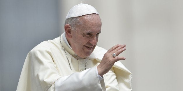 Pope Francis blesses the crowd at the end of his the weekly general audience at St Peter's square on May 6, 2015 at the Vatic