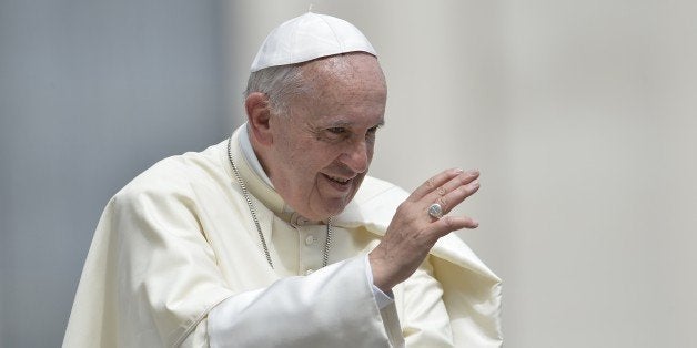 Pope Francis blesses the crowd at the end of his the weekly general audience at St Peter's square on May 6, 2015 at the Vatican. AFP PHOTO / ANDREAS SOLARO (Photo credit should read ANDREAS SOLARO/AFP/Getty Images)