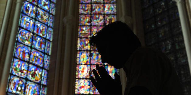 TO GO WITH AFP STORY IN FRENCH BY FRANCOIS FEUILLEUX: 'LA CATHEDRALE DE CHARTRES VA RETROUVER SON ECLAT ET SON DECOR ARCHITECTURAL DU XIIIe SIECLE'- A man prays, on August 26, 2009, in one of the restored chapels of the Cathedral of Chartres, 90 kilometers (55 miles) southwest of Paris. The cathedral which was built from 1194 to 1225, is one of the finest exemple of France Gothic church architecture. Renovation works started a few months ago to restore the interior of the monument financed by the French government, the French region Centre and the European Union as local associations are also raising funds for the restoration of the stained glass. AFP PHOTO ALAIN JOCARD (Photo credit should read ALAIN JOCARD/AFP/Getty Images)