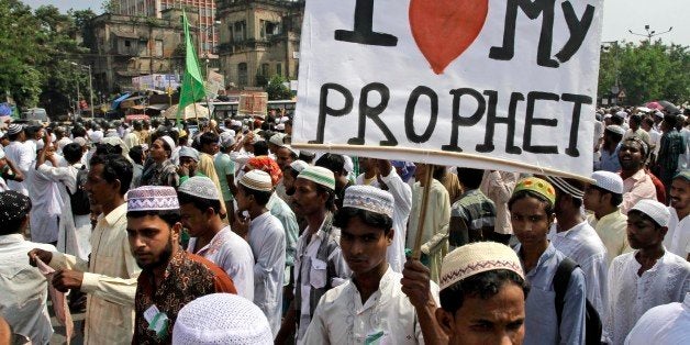 Indian Muslims march towards the U.S. consulate during a protest rally against the film "Innocence of Muslims" that ridicules Islam's Prophet Muhammad, in Kolkata, India, Thursday, Sept. 27, 2012. Thousands of angry Muslims have marched in Kolkata in eastern India to protest the anti-Islam film produced in the United States. (AP Photo/Bikas Das)