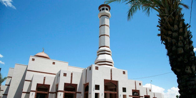 FILE- This Monday, May 4, 2015 file photo shows the Islamic Community Center of Phoenix. A civil rights group has asked the FBI to investigate a threatening letter sent to the Phoenix mosque that was once a place of worship for suspects in a shooting three weeks ago at a Texas cartoon contest featuring cartoons of the Prophet Muhammad. (AP Photo/Ross D. Franklin, File)