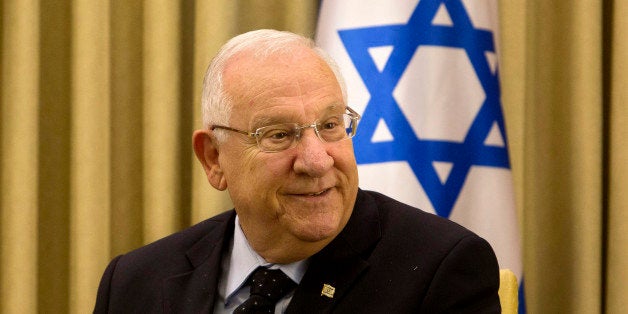 Israel's President Reuven Rivlin, smiles during his meeting with German Foreign Minister Frank-Walter Steinmeier at the President's residence in Jerusalem, Sunday, May 31, 2015. Steinmeier is on an official visit to the region. (AP Photo/Sebastian Scheiner)