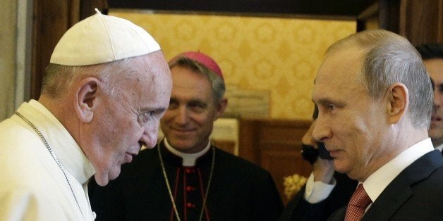 Pope Francis (L) meets with Russian President Vladimir Putin on the occasion of a private audience at the Vatican, on June 10