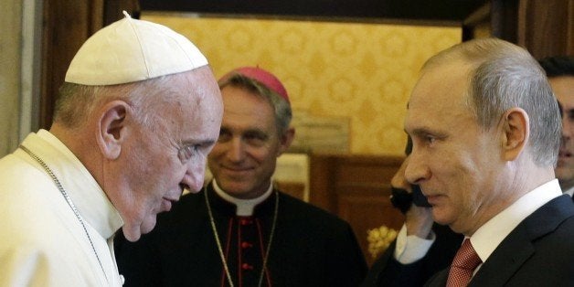 Pope Francis (L) meets with Russian President Vladimir Putin on the occasion of a private audience at the Vatican, on June 10, 2015. AFP PHOTO POOL / GREGORIO BORGIA (Photo credit should read GREGORIO BORGIA/AFP/Getty Images)