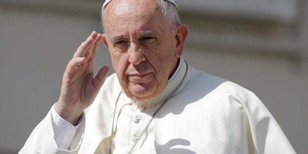 Pope Francis waves as he arrives for his weekly general audience, in St. Peter's Square at the Vatican, Wednesday, June 17, 2015. (AP Photo/Andrew Medichini)